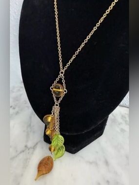 Vintage Cookie Lee collection gold tone hardware and brown and green glass beads